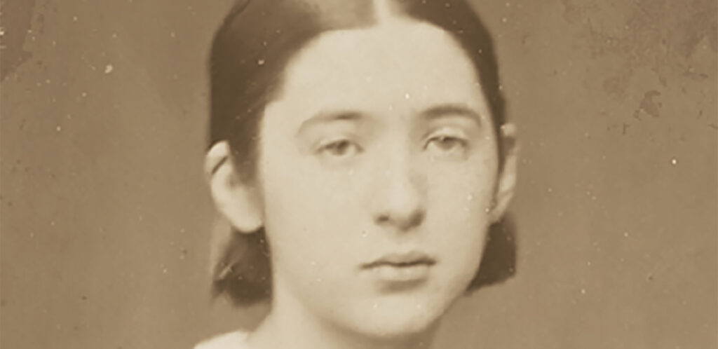 Sepia photograph of a young girl with short hair.