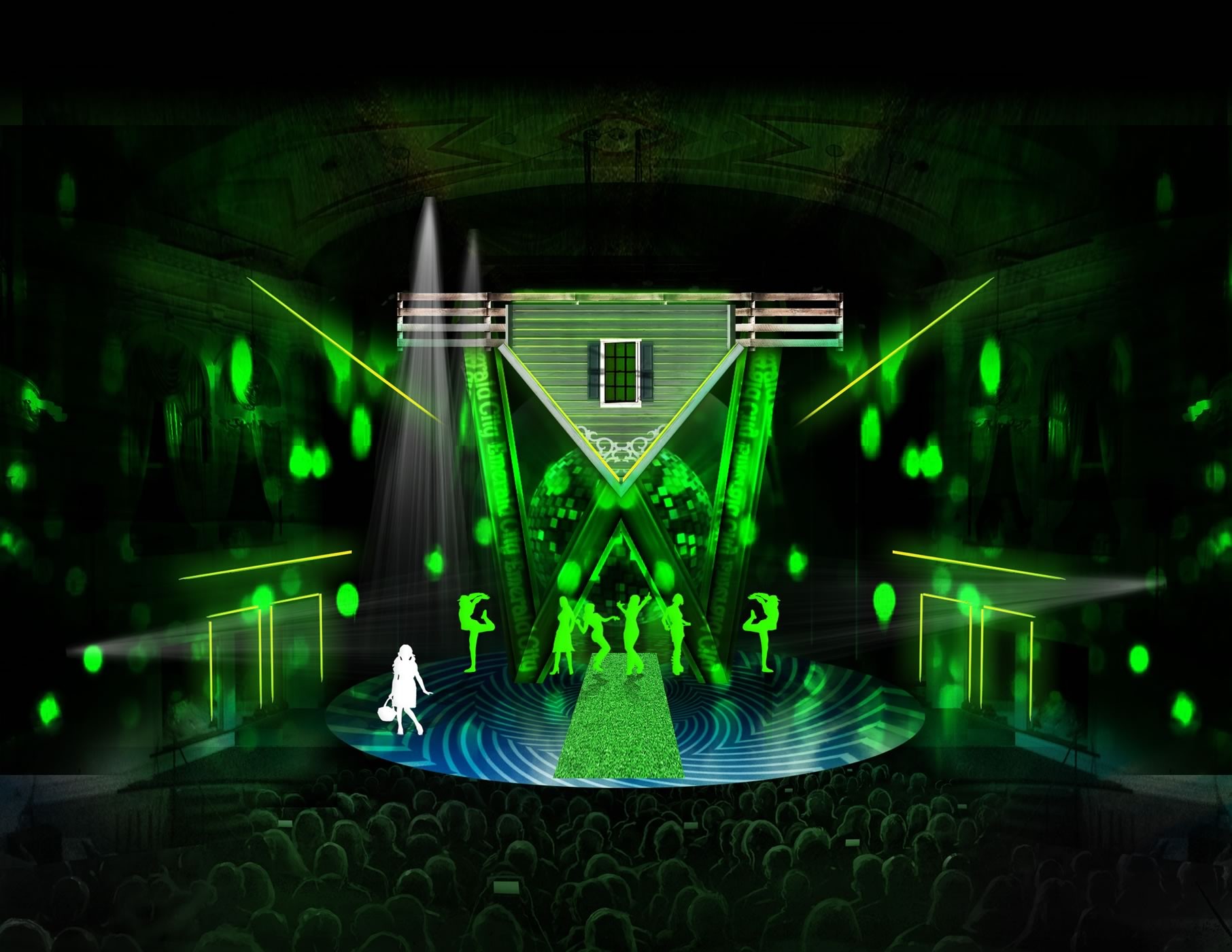 set design for The Wiz in the Emerald City scene includes dramatic kelly-green lighting in directed beams all over the stage, an inverted house with peaked roof floating above the stage.  