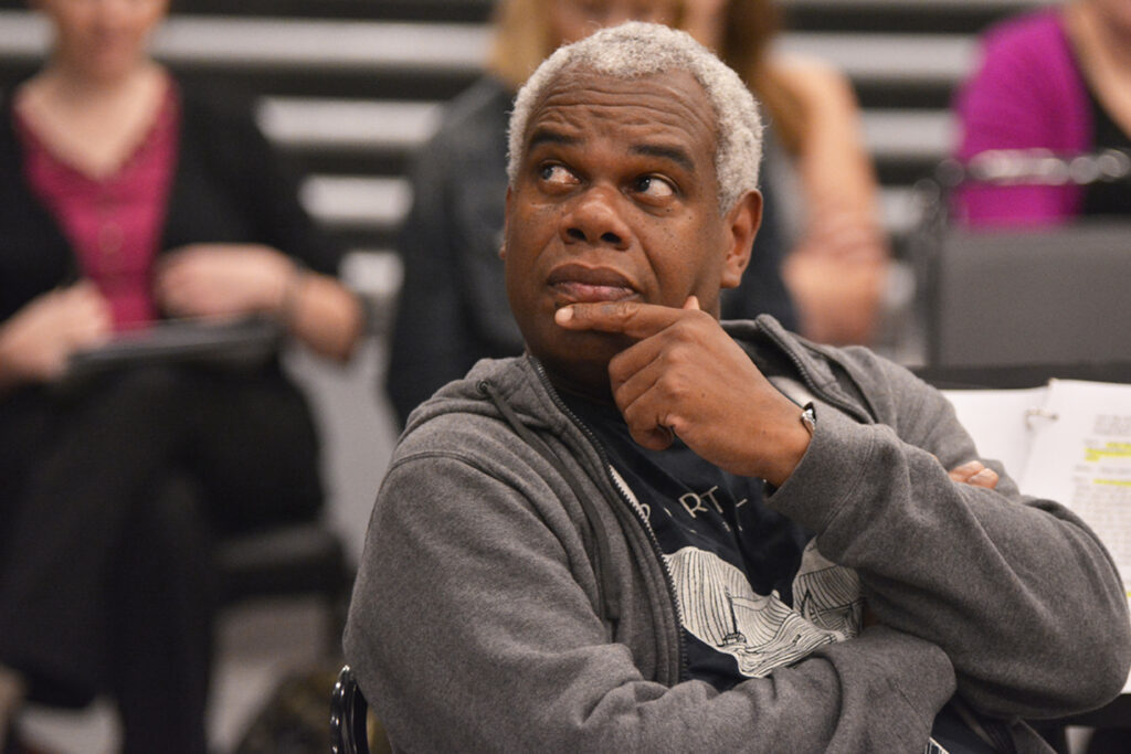 Actor Craig Wallace listens to a speaker (not pictured) during rehearsal for “Fences.”