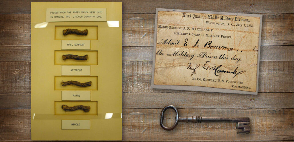 A photograph of memorabilia from the trail of the conspirators: locks of hair, a key and document from a military prison.