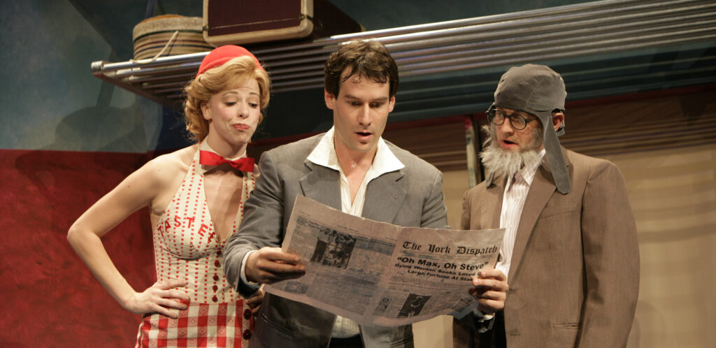 A woman in roller-skates, a red bowler hat, short gingham red-and-white skirt and a fitted, sleeveless vest reads a newspaper over the shoulder of two men in a train car. One man has a medieval-style beard and cap. The other is dressed like a traveling salesman.