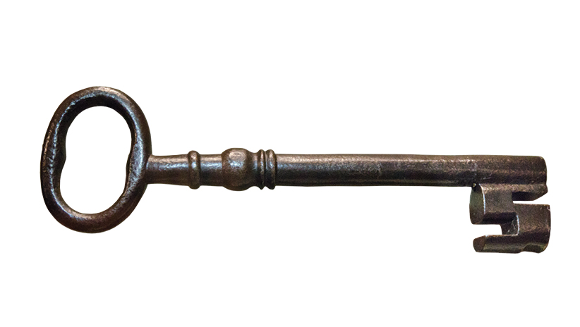 Photograph of a large metal key.