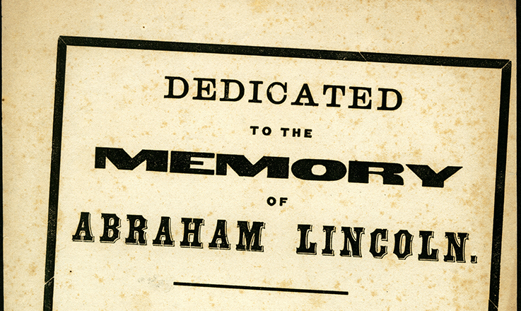 Image of a faded document reading "Dedicated to the memory of Abraham Lincoln."