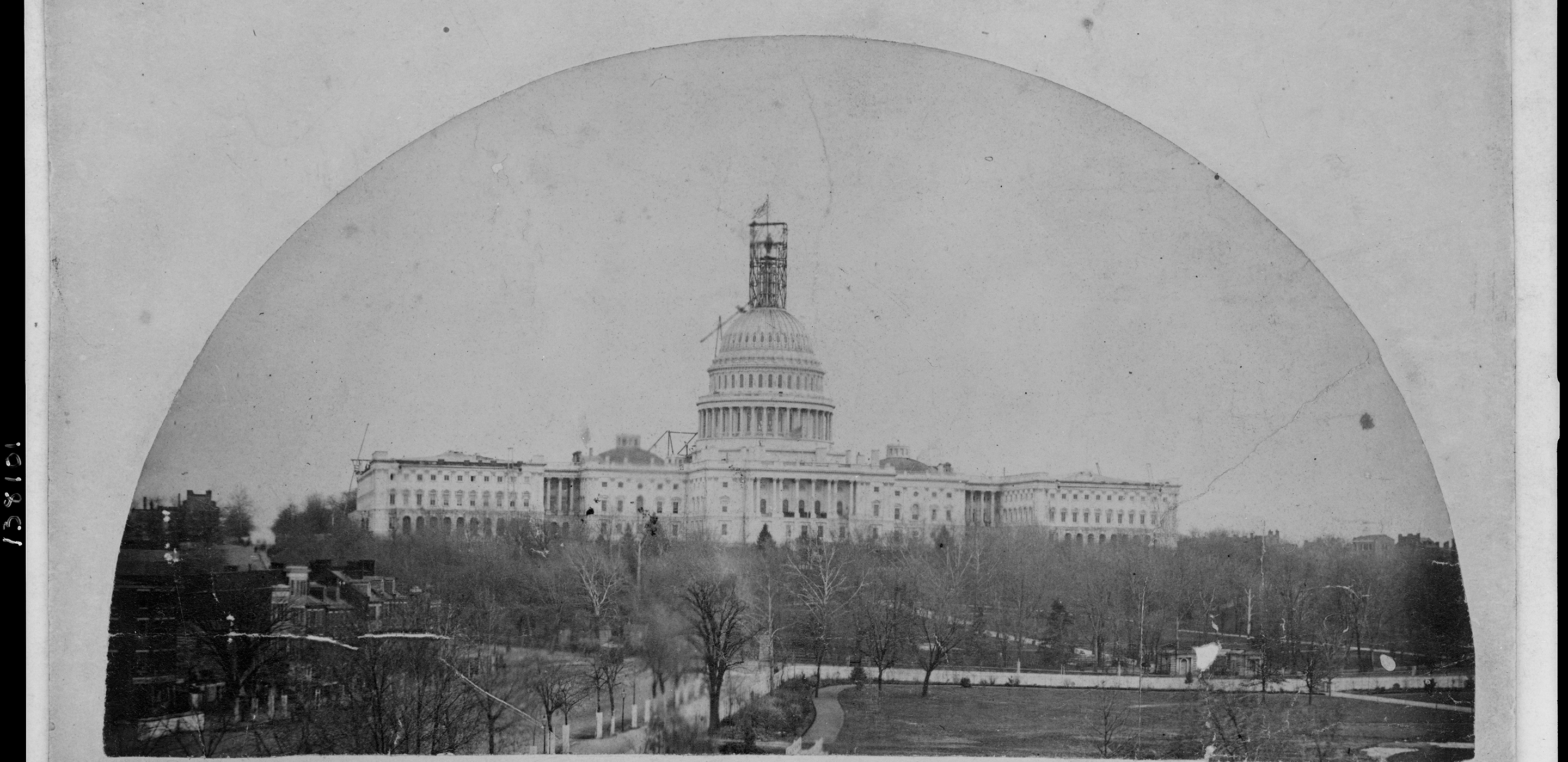 Photograph showing Capitol building with scaffolding surrounding Thomas Crawford's Statue of Freedom atop the dome.