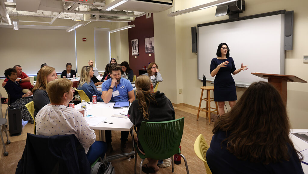 A teaching artist leads an oratory workshop.