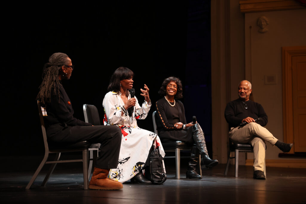 Three Black women and one Black man sit in chairs on the Ford’s Theatre stage for a talkback.