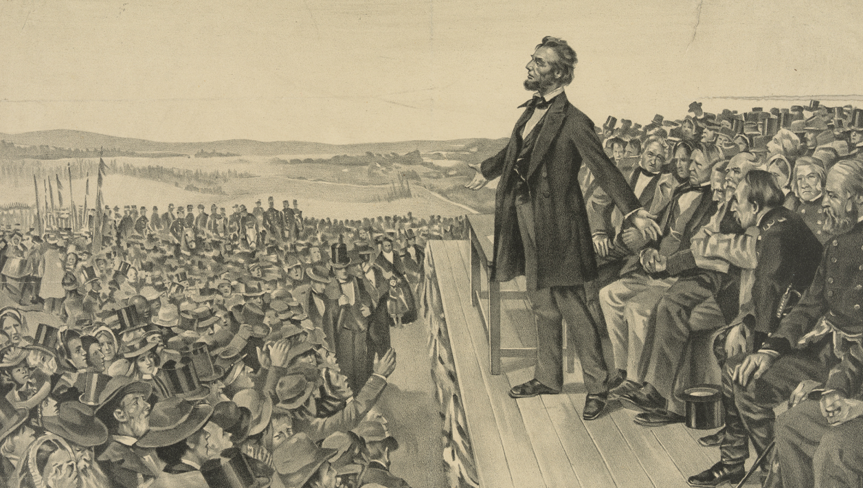 Black and white newspaper print showing Abraham Lincoln standing on stage before a crowd of people.