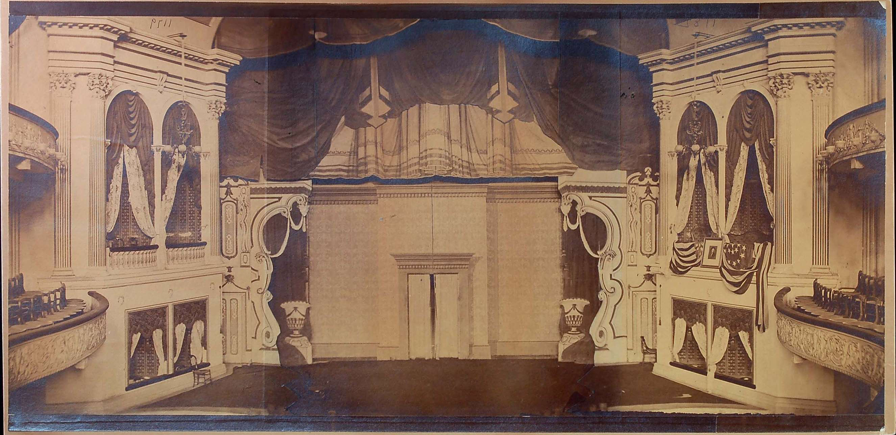 1865 black and white photograph of the empty stage set of Our American Cousin in Ford’s Theatre.